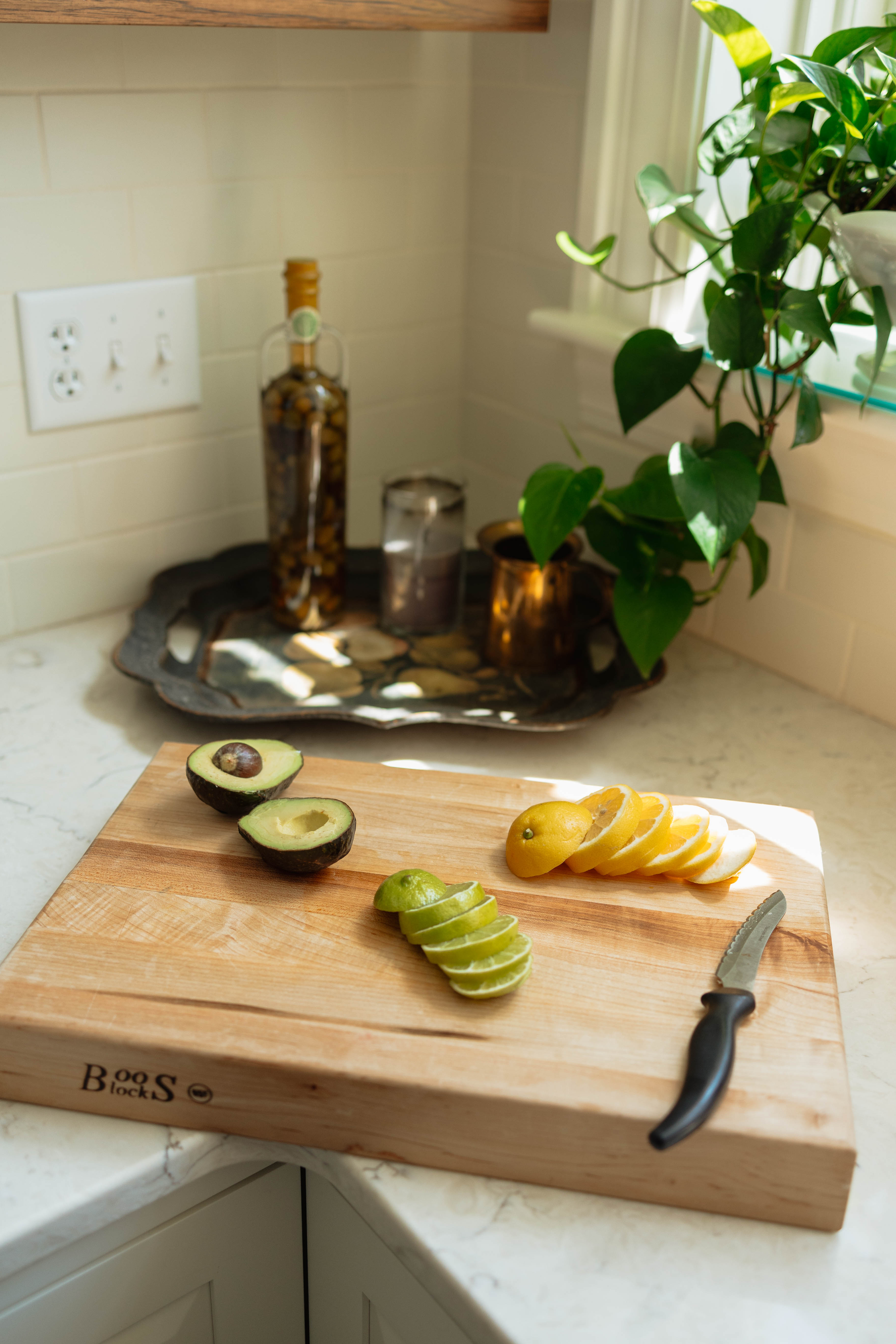 A sunlit kitchen with prepared citrus